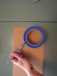 Trace and cut a circle out of cardboard.