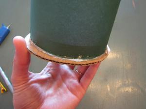 Glue your cylinder and your circle together with two layers of glue